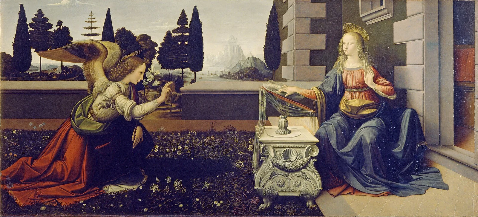 The angel Gabriel kneels before Mary in a garden, holding a lily as she turns from her reading; distant mountains rise beyond the trees.